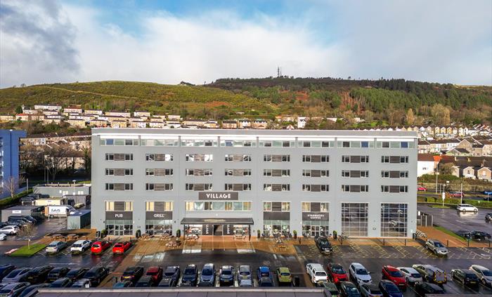 Aerial shot of the exterior of a hotel.